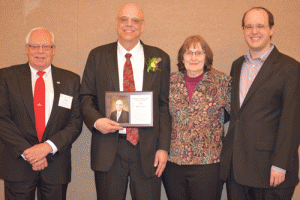 Art Duerksen, Mike Jordan and his wife, Joyce, and their son Gregory, celebrate Mike's induction into the Kansas Cooperative Hall of Fame.